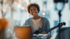 Woman happily playing the guitar